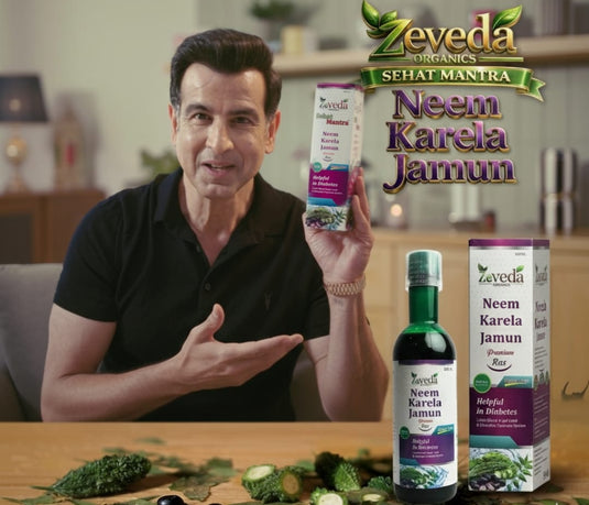Man holding Zeveda Neem Karela Jamun products with packaging and ingredients on a table.